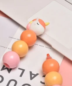 Alternative view of Resaltador Apilable BOLITAS - Unicornio